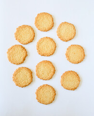 Top view  of biscuit or cookie on white background. Biscuit a flour-based baked food product ,sweet and crunchy as dessert. Selective focus.