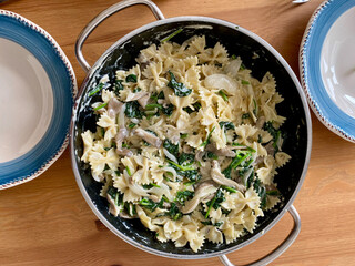 Bow Tie Pasta with Spinach and Cream in Pan. Ready to Serve and Eat.