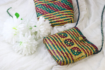 Tas anyaman purun, Indonesian traditional woven tote bag from Banjarmasin, South Kalimantan. Isolated white background. Bright concept product photography.  