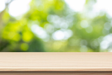 wooden table on green bokeh background