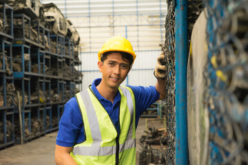 Man working, Asian engineer worker smile and look straight in factory-warehouse