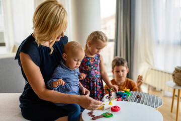 Happy child kids group have fun and play at kindergarden