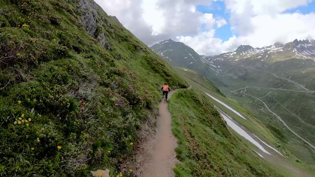 Mountain Biker Riding the Scenic Riale to Passo del Gries Trail, Val Formazza, Italian Alps