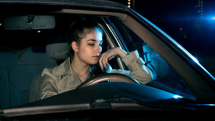 Girl driving car at night