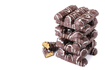 Cookies chocolate sticks whole and halves stacked isolated on a white background