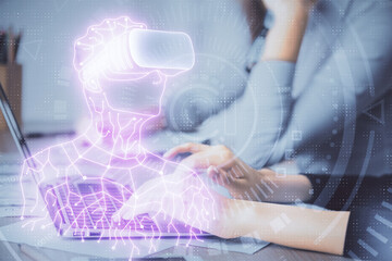 Fototapeta premium Double exposure of woman hands typing on computer and man in AR glasses drawing. Education concept.