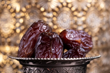 Religious Islamic festival and holy month of Ramadan, EID KAREEM, concept: Close up on a metallic...