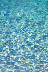 Photo for background material close up on the ripples of clear blue water shining in the sunlight