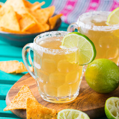 Mexican alcohol cocktail chelada with light beer and lime juice