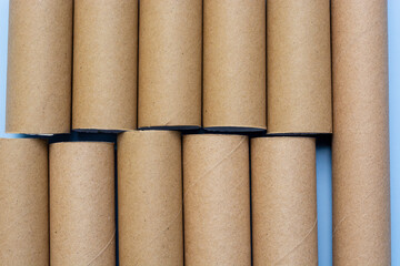 Empty toilet rolls on light blue background