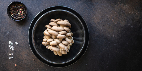 fresh oyster mushroom raw mushrooms meal snack diet vegan or vegetarian food copy space food background rustic. top view 