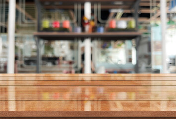 Empty wooden table top with lights bokeh on blur restaurant background