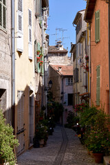 Fototapeta na wymiar Typical alley in the french village of Biot, commune is a small fortified medieval hilltop village in the Provence-Alpes-Côte d’Azur near Antibes, between Nice and Cannes.