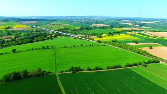 Aerial view of a rail bridge and nearby countryside views in Bauerbach, Germany