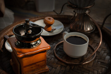 Coffee roaster and coffee set on a wicker tray