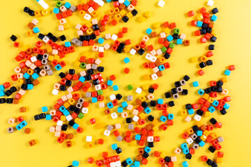 Children's mosaic on a yellow background. Child Game. Hobby. Child development and leisure concept. High quality photo