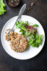 buckwheat salad green mix salad lettuce diet vegan or vegetarian food meal snack copy space food background rustic. top view