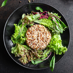 buckwheat salad green mix salad lettuce diet vegan or vegetarian food meal snack copy space food background rustic. top view