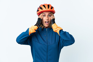 Young blonde Uruguayan cyclist woman isolated on background with surprise expression