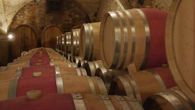 Wine barrels barrique in wine cellar