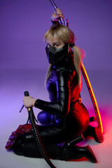 Woman in cyberpunk style posing with sword