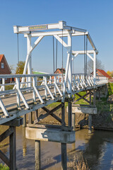 Fototapeta na wymiar Historic wooden drawbridge at Steinkirchen, Altes Land region, Lower Saxony, Germany