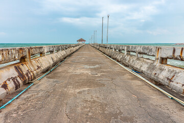 Old grunge concrete pier at Thung Wua Laen beach. It is in Chumphon province, Southern Thailand.