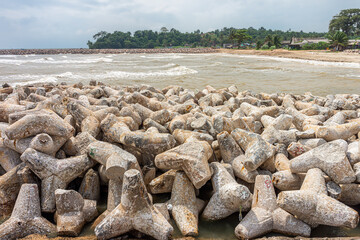 Tetrapods are used to enforce coastal structures such as seawalls and breakwaters in Chumphon province, Thailand. They are made of concrete, and use a tetrahedral shape.