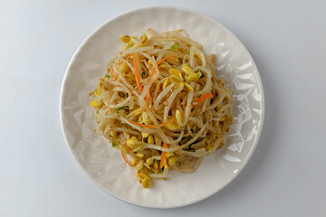 Tossed bean sprouts on a white background