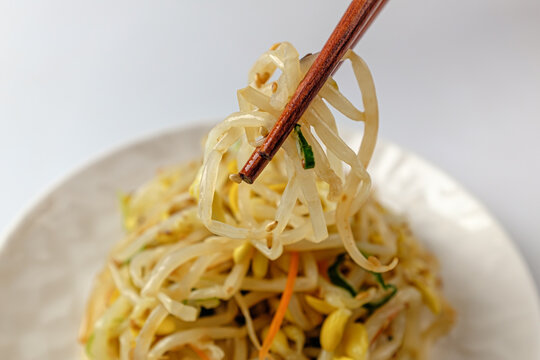 Tossed bean sprouts on a white background