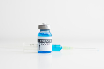 Coronavirus vaccine bottle with sryinge.Vaccination covid-19, medical research and development concept.