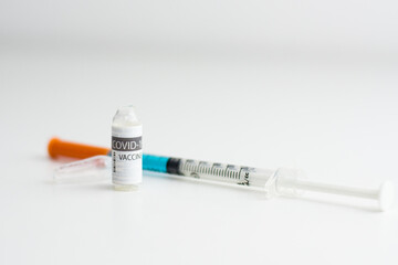 Coronavirus vaccine bottle with sryinge.Vaccination covid-19, medical research and development concept.