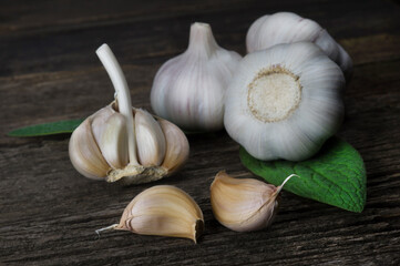Fresh fragrant garlic cloves on a wooden background. Vegetables ingredients for cooking.