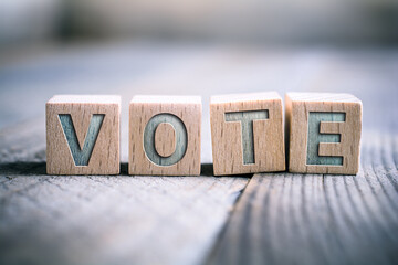 Vote Written On Wooden Blocks On A Board - Time For A Change Concept