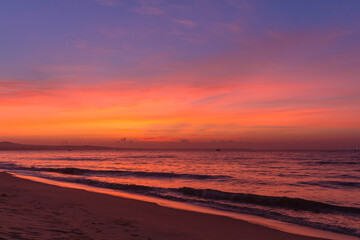 Fototapeta na wymiar Sea sunrise with waves, Vietnam