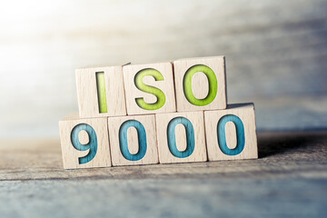 ISO 9000 Written On Wooden Blocks On A Board