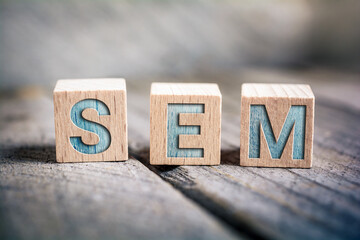 SEM Search Engine Marketing Written On Wooden Blocks On A Board