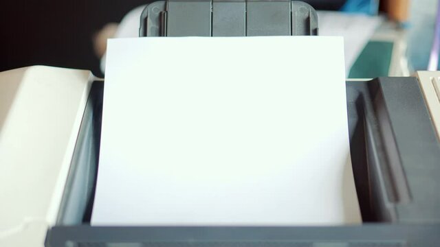 Paper From Printer In Office.Businessman Working In Office And Preparing Documents For Signature. Businessman Printing Document On Workplace.Office Laser Jet Printer Printing A4.