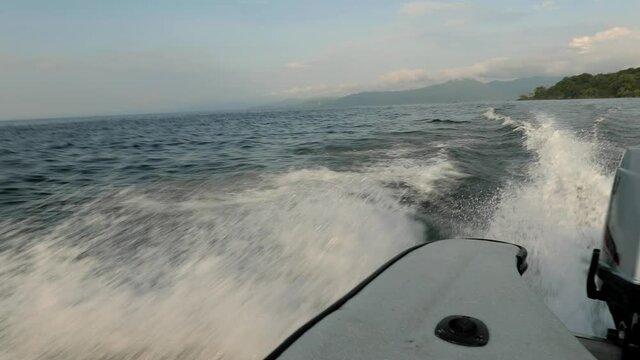 Splashing waves motorboat wake