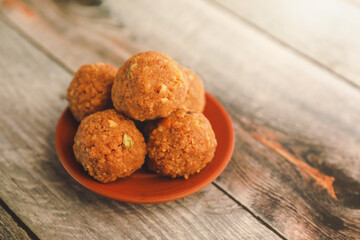 Indian traditional snacks sweet laddu or laddoo
