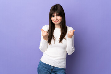 Young Ukrainian woman isolated on purple background making money gesture but is ruined