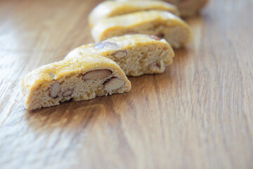Sweet biscotti cookies with nuts on wooden background. Side vie