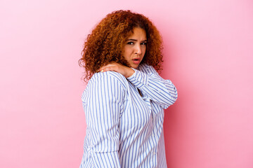 Young latin curvy woman isolated on pink background having a shoulder pain.