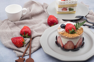 Fresh strawberry cake with cream in close up.