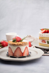 Fresh strawberry cake with cream in close up.