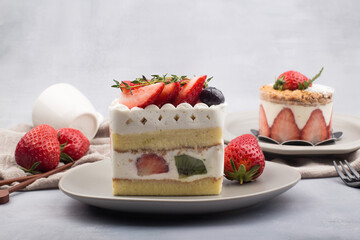 Fresh strawberry cake with cream in close up.