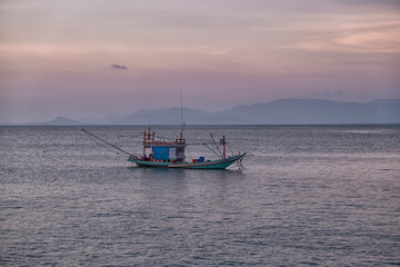 Naklejka na ściany i meble fishing boats at sunset