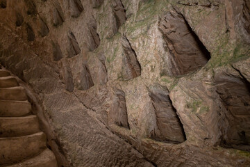 Niches  for pigeons in the wall of the economic cave - columbarium - a dovecote near the excavations of the ancient Maresha city in Beit Guvrin, near Kiryat Gat, in Israel