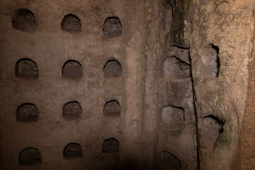 Niches  for pigeons in the wall of the economic cave - columbarium - a dovecote near the excavations of the ancient Maresha city in Beit Guvrin, near Kiryat Gat, in Israel