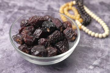 close up of fresh date fruit in a bowl on table 